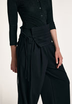 Рants with a cummerbund belt.